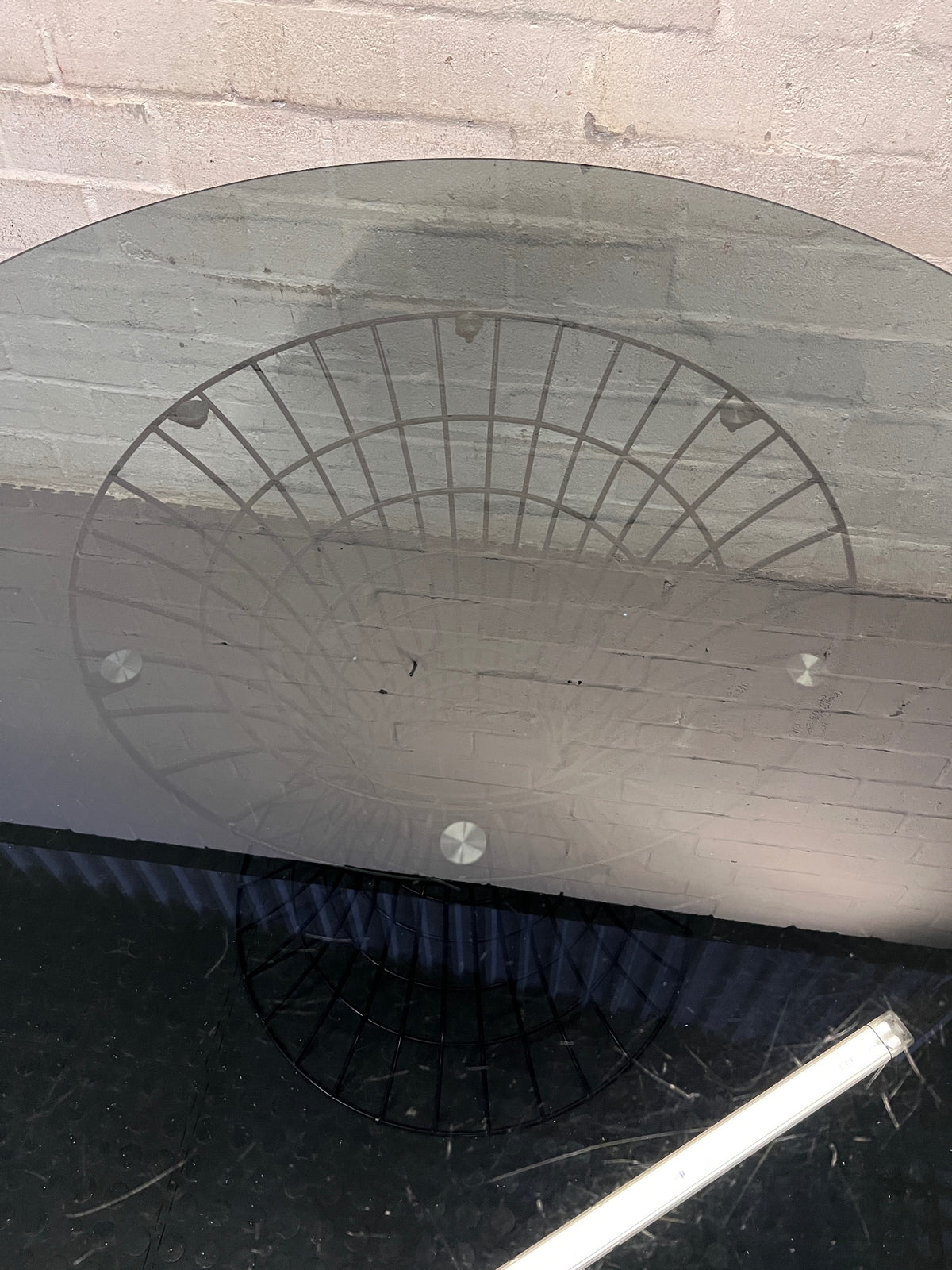 Round Smoked Glass Dining Table with Black Steel Wire Base — Very Good Condition – back view