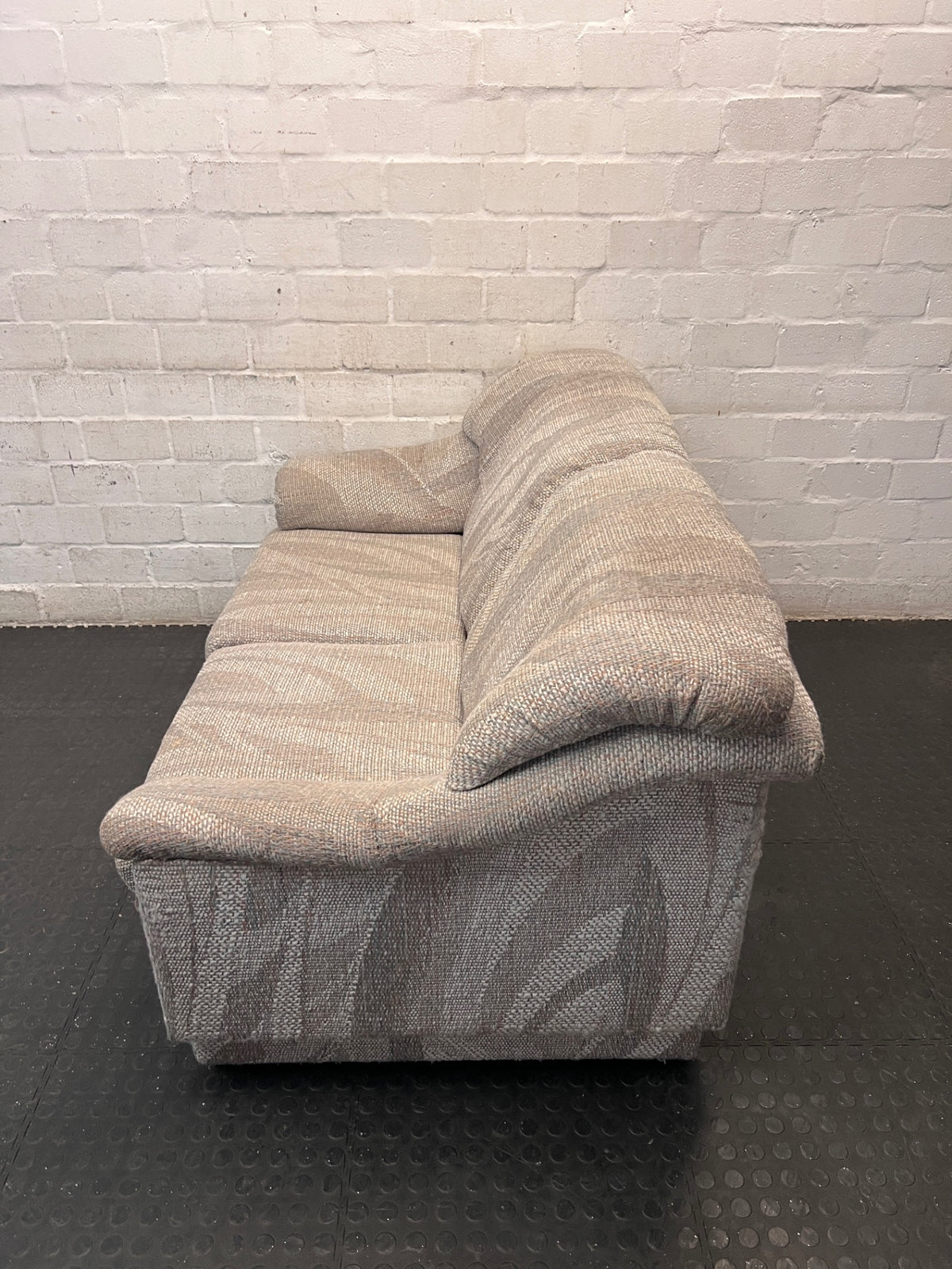 Textured Grey Patterned 2 Seater Couch — Fair Condition – side view