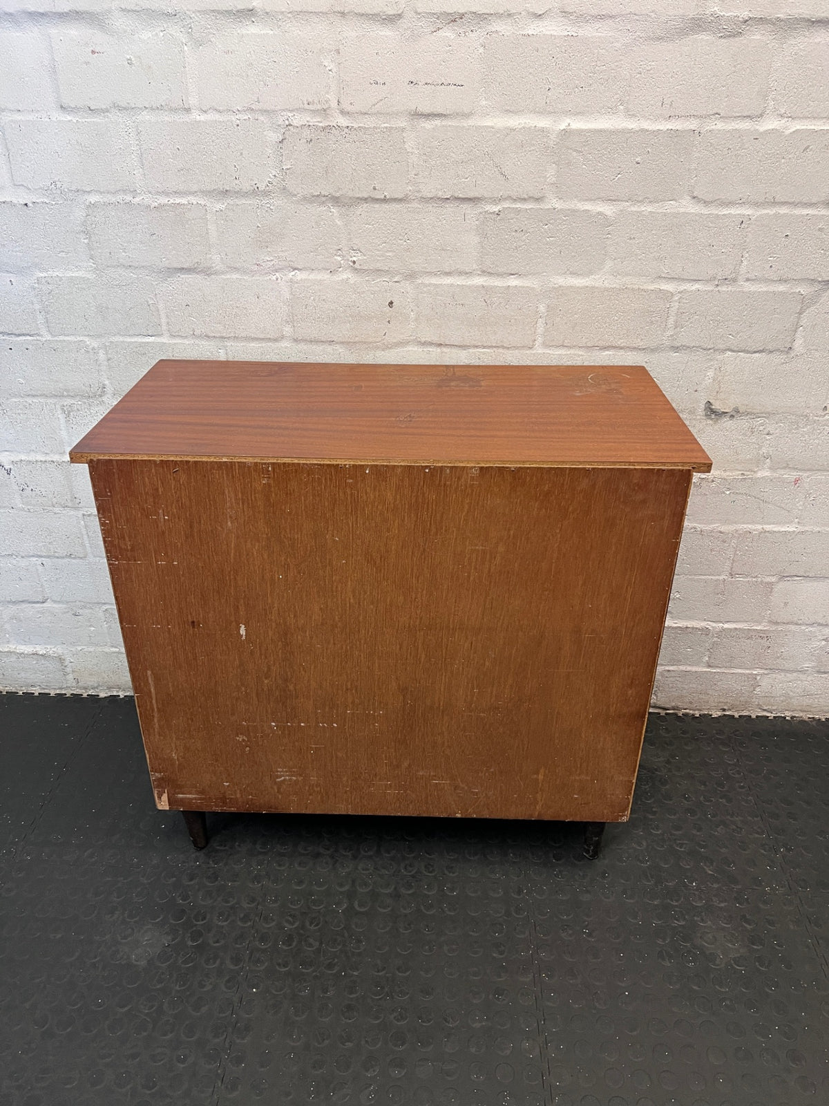 Mid-Century Style Four Drawer Chest in Brown Finish — Chipped Surfaces and Missing Handles – back view