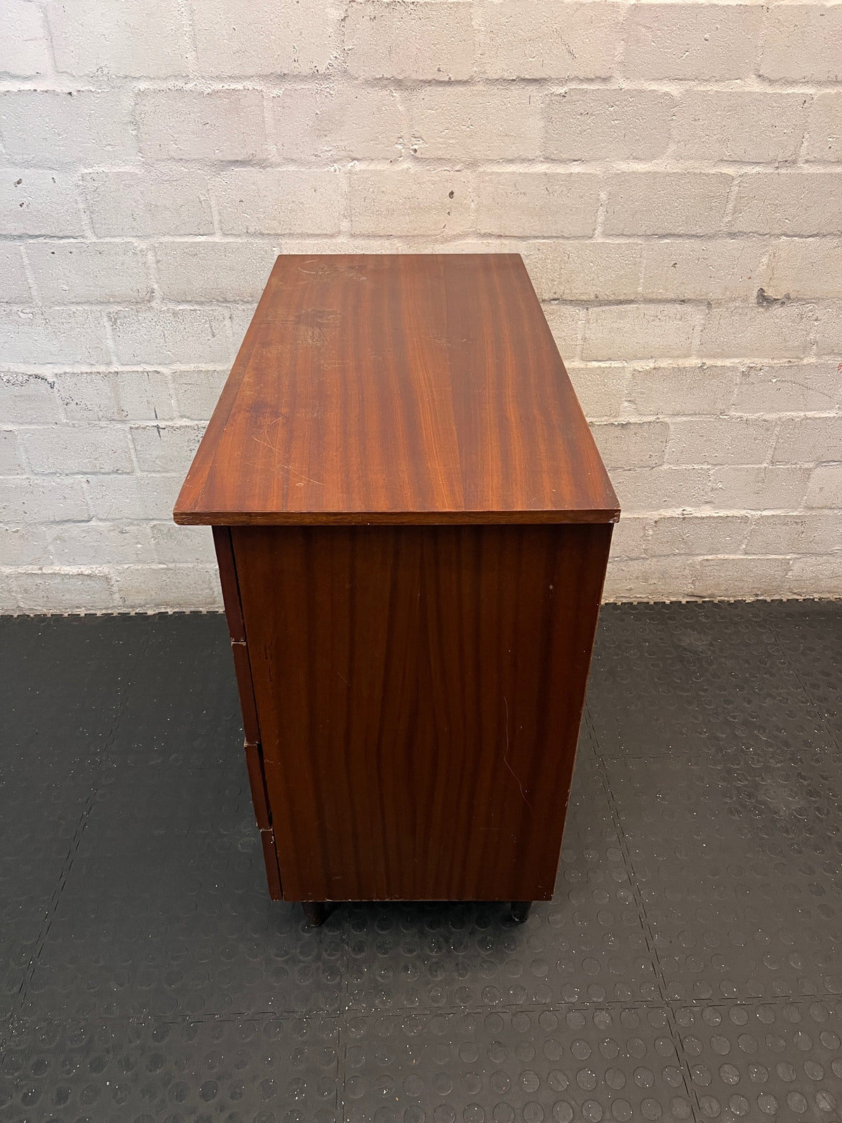 Mid-Century Style Four Drawer Chest in Brown Finish — Chipped Surfaces and Missing Handles – condition detail