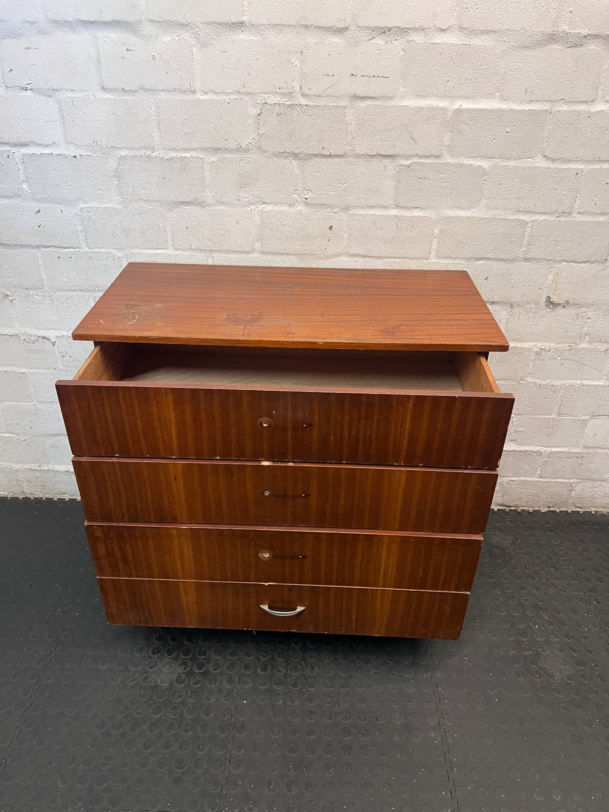 Mid-Century Style Four Drawer Chest in Brown Finish — Chipped Surfaces and Missing Handles – side view