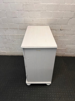 White Wooden Chest of Drawers with Bun Feet — Visible Paint Chips; Working Order – condition detail