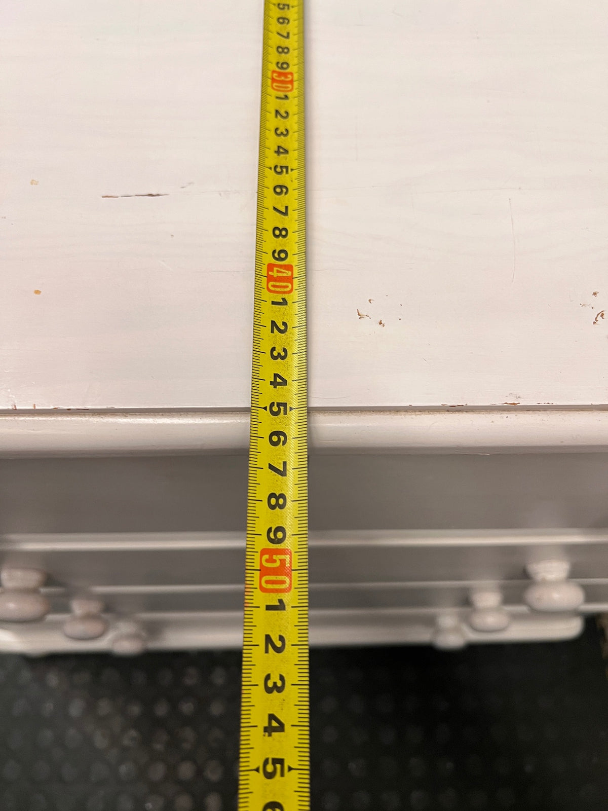 White Wooden Chest of Drawers with Bun Feet — Visible Paint Chips; Working Order – depth measurement