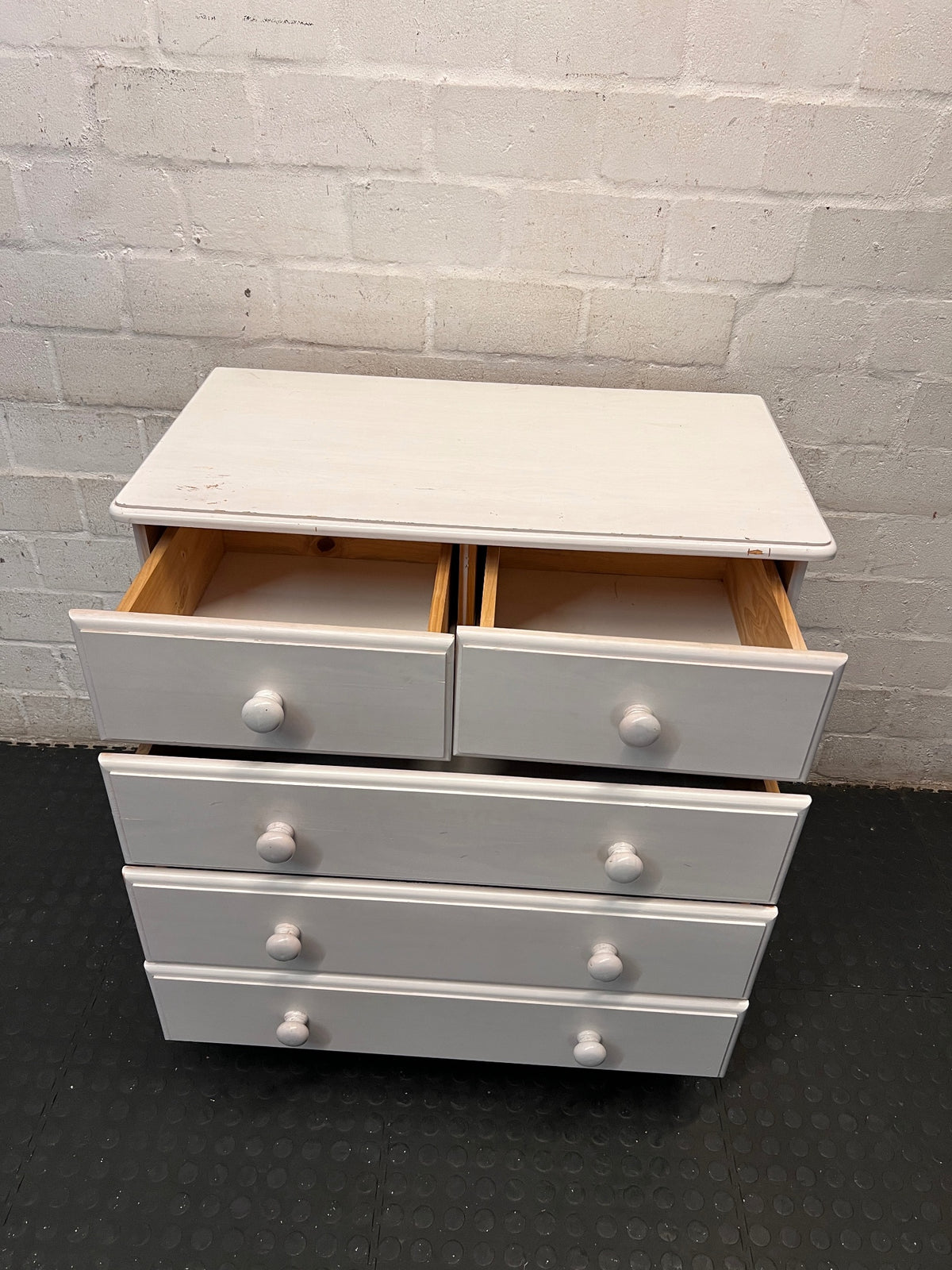 White Wooden Chest of Drawers with Bun Feet — Visible Paint Chips; Working Order – side view