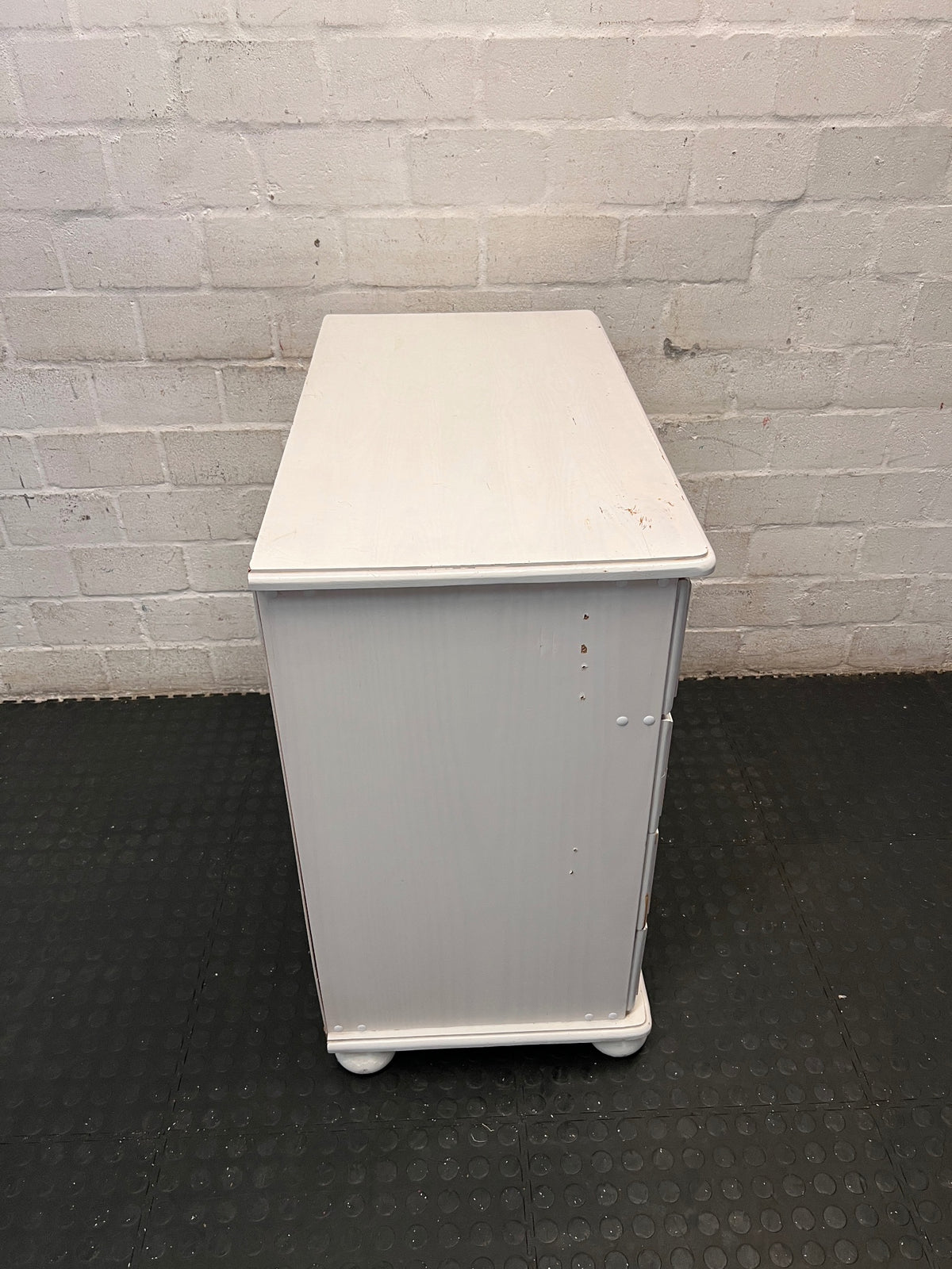 White Wooden Chest of Drawers with Bun Feet — Visible Paint Chips; Working Order – top view