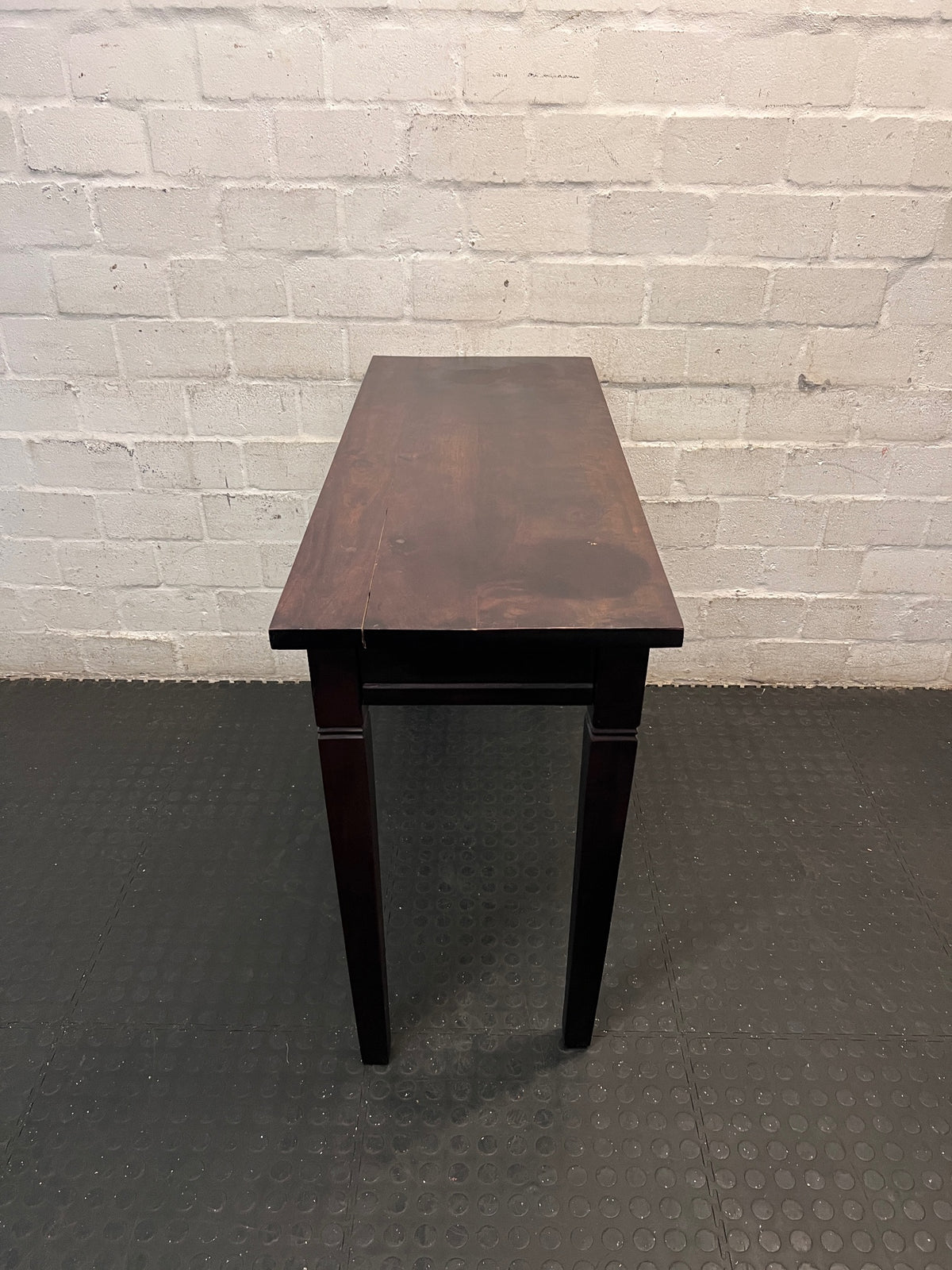 Dark Brown Wooden Console Table with Drawer — Fair Condition with Visible Wear – side view