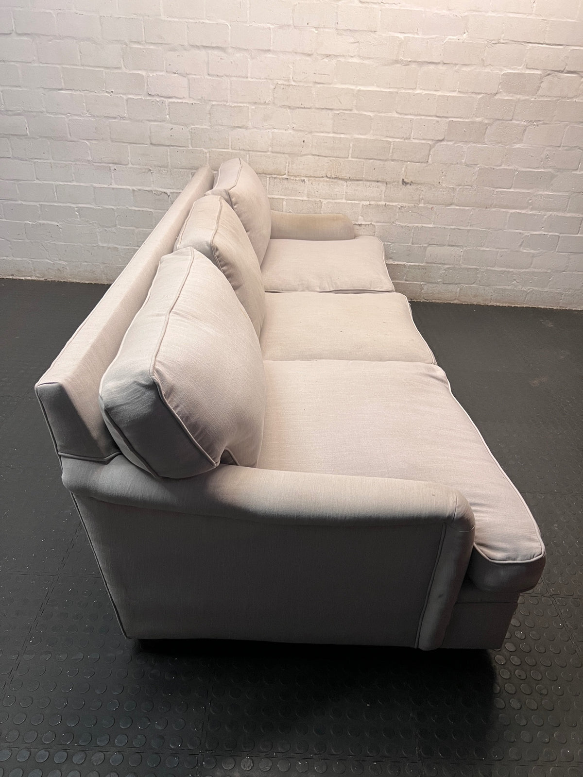 Light Grey 3 Seater Couch with Feather Inner — Visible Wear and Minor Stains – back view
