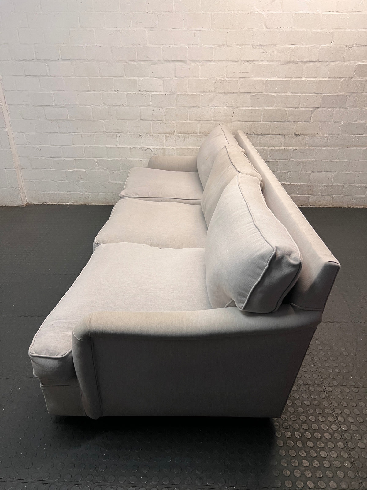 Light Grey 3 Seater Couch with Feather Inner — Visible Wear and Minor Stains – side view