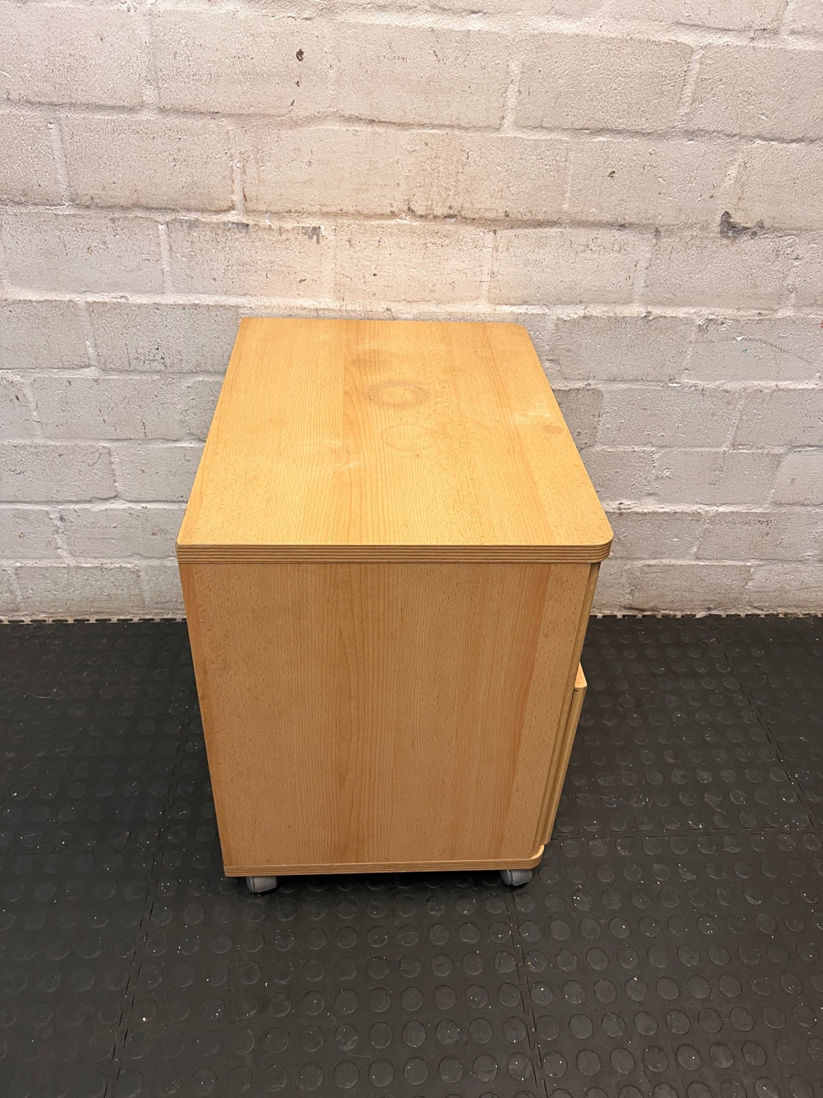 Mobile Light Wood Pedestal with Drawer and Cubby – top view