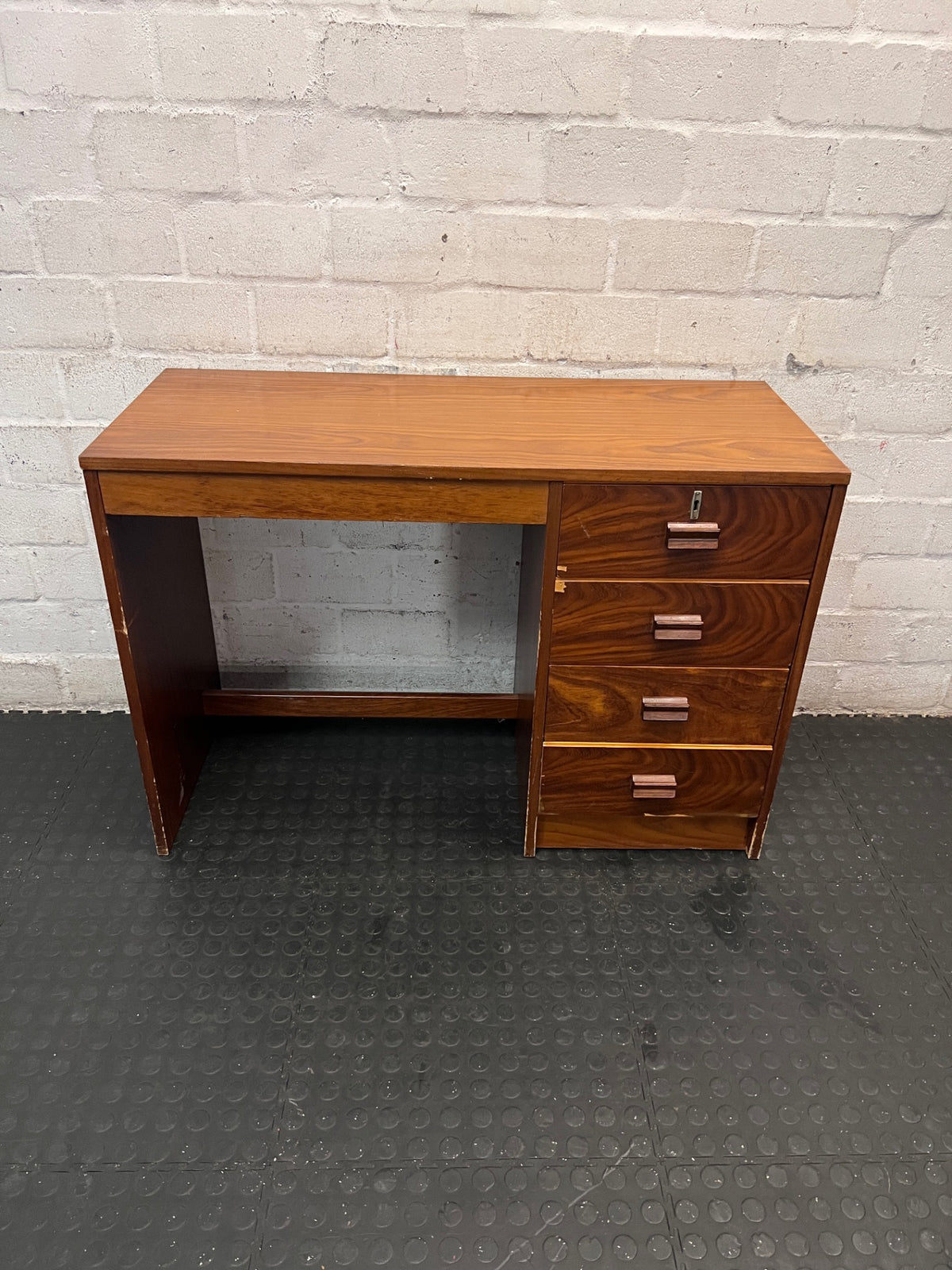 Wooden Office Desk with 4 Drawers — Chipped Veneer and Surface Wear – main front view