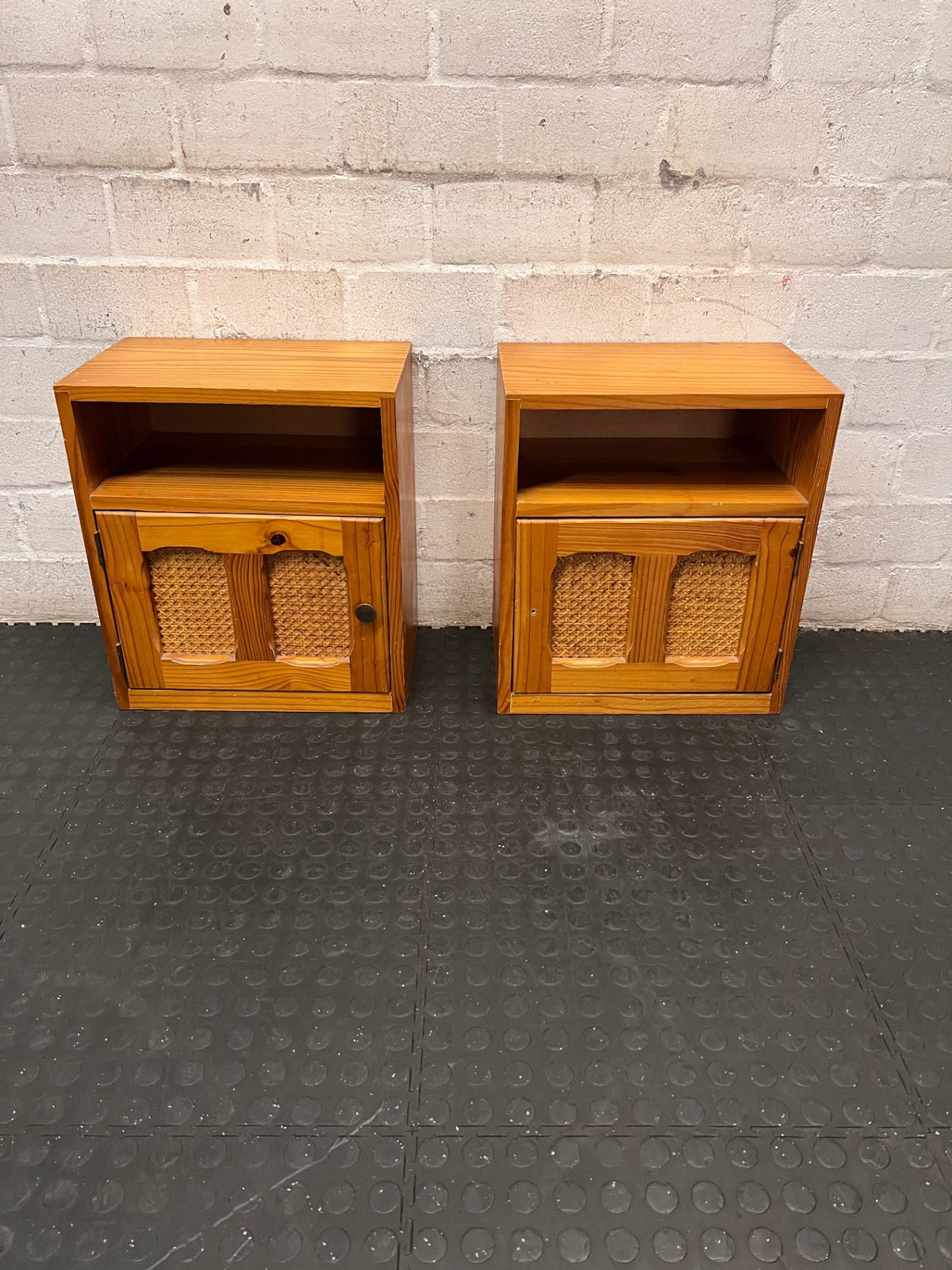 Wooden Bedside Table with Rattan-Style Door Insert — Fair Condition With Visible Wear – side view