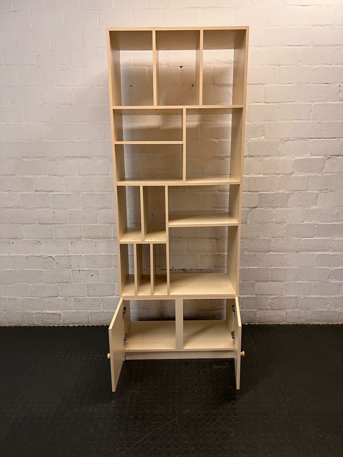 Asymmetrical Shelving Unit with Bottom Cupboard – side view