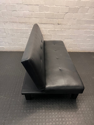Black Tufted Leather-Look Sleeper Couch — Good Working Order – top view