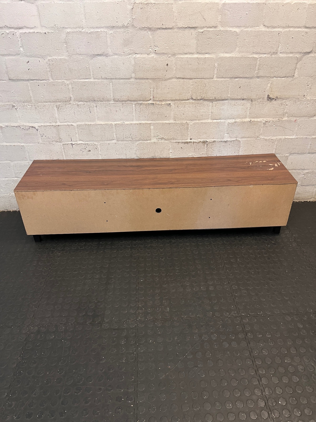 Brown and Black Low-Profile TV Unit — Surface Marks and Peeling on Top – back view