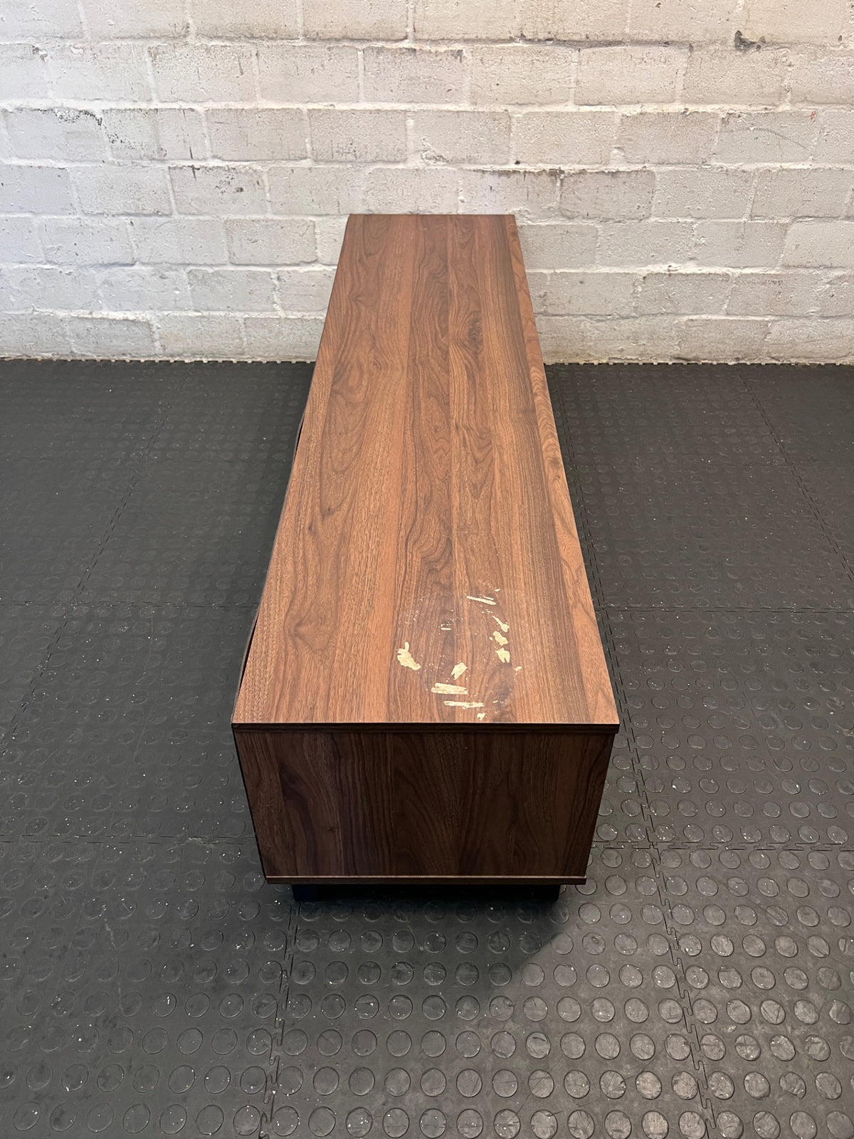 Brown and Black Low-Profile TV Unit — Surface Marks and Peeling on Top – top view