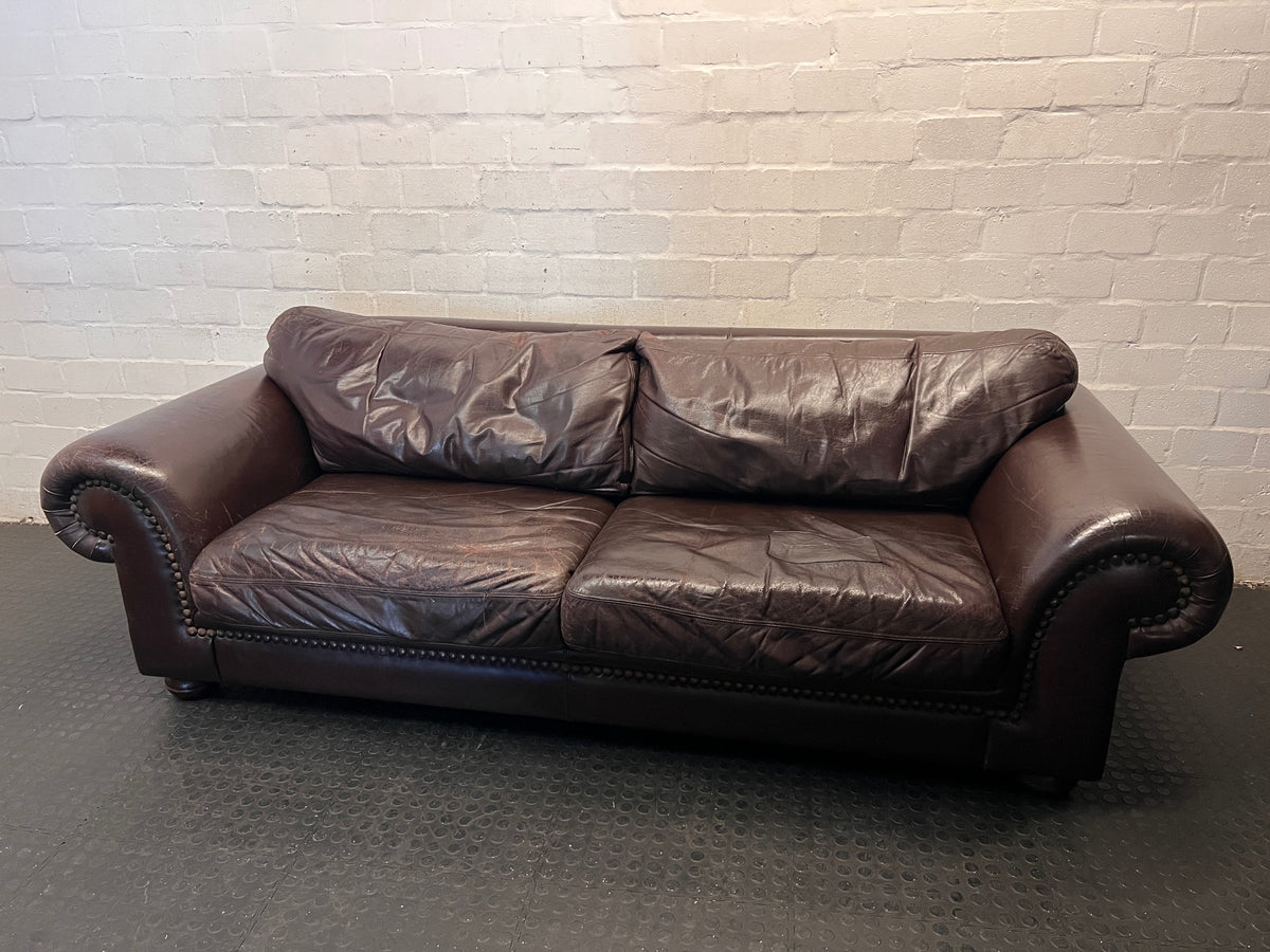 Coricraft Brown Leather 2 Seater Couch with Stud Detail — Broken Zip on Seat Cushion – main front view