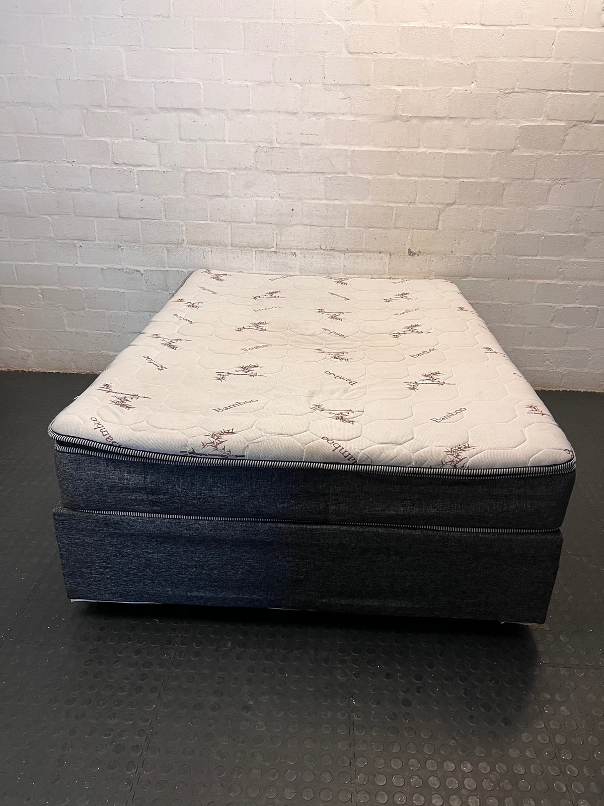 Queen Bamboo Pattern Mattress and Grey Upholstered Base — Mattress in Poor Condition; Base Shows Wear – condition detail