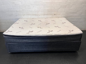 Queen Bamboo Pattern Mattress and Grey Upholstered Base — Mattress in Poor Condition; Base Shows Wear – side view
