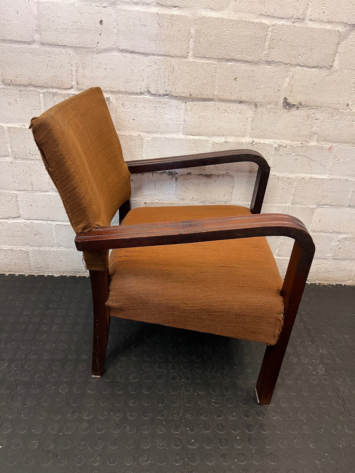 Vintage Armchair with Curved Wooden Arms — Well-Used Condition with Significant Wear – side view