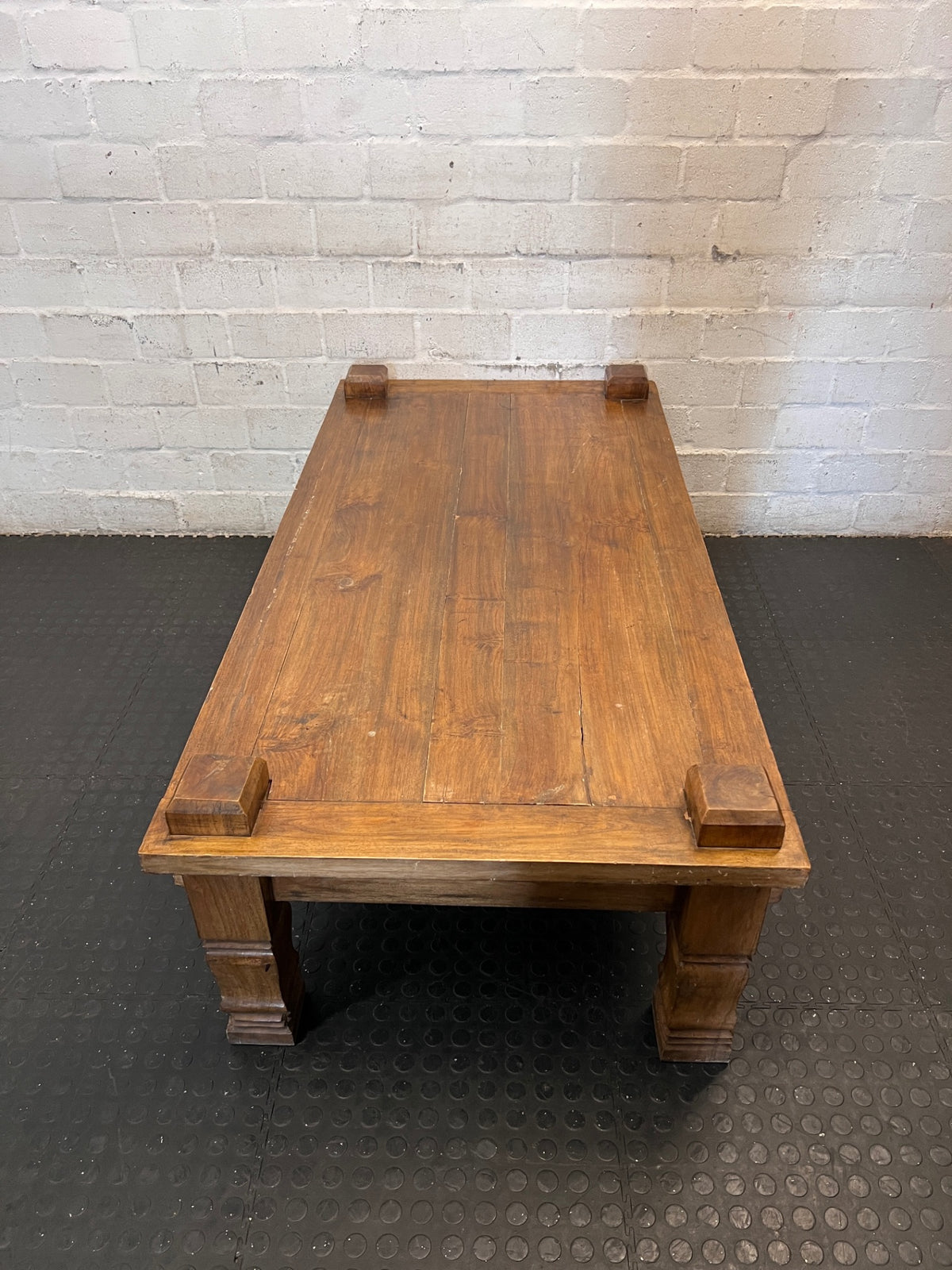 Solid Wooden Coffee Table with Carved Chunky Legs — Visible Wear Throughout – back view
