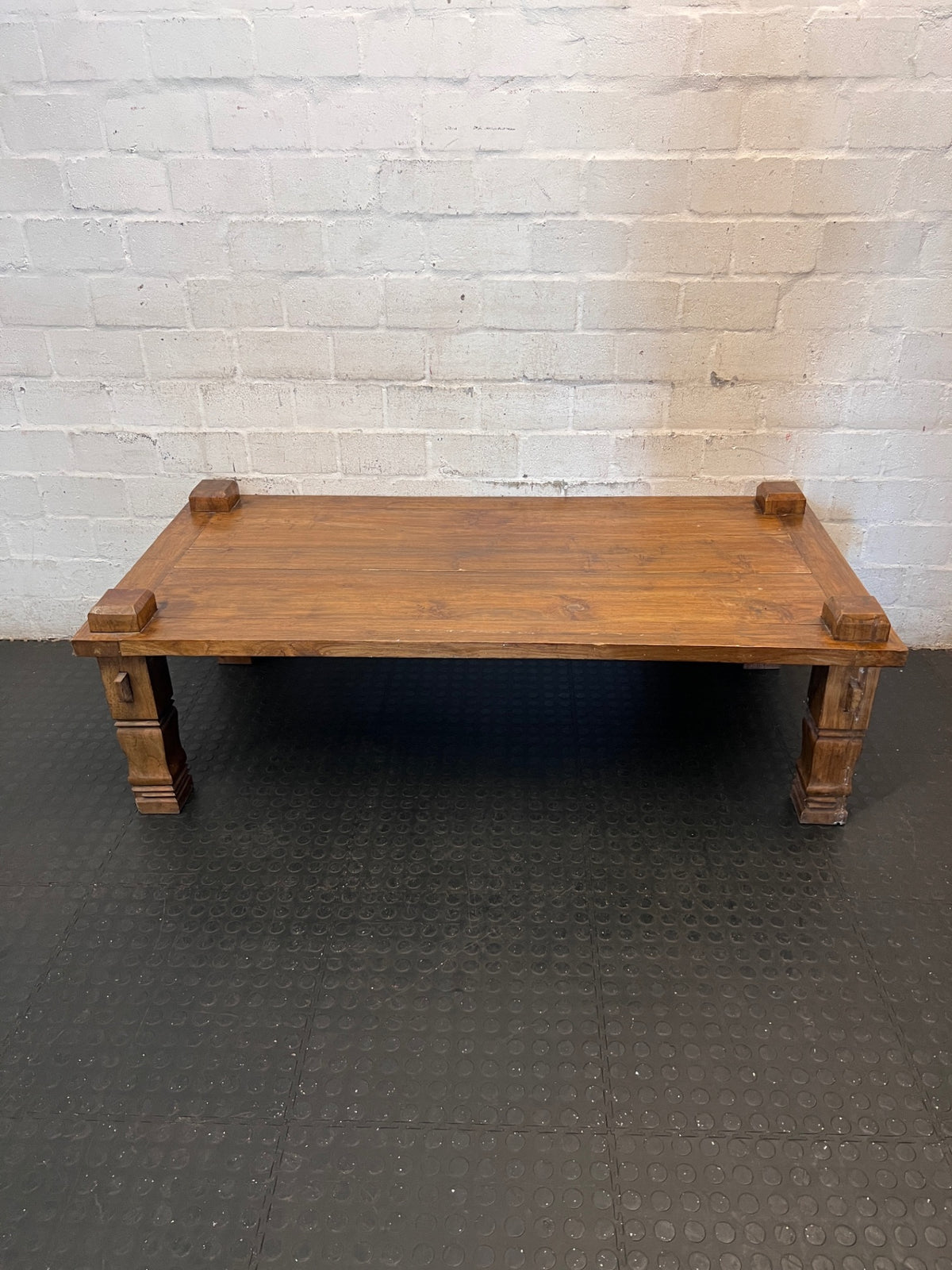 Solid Wooden Coffee Table with Carved Chunky Legs — Visible Wear Throughout – condition detail