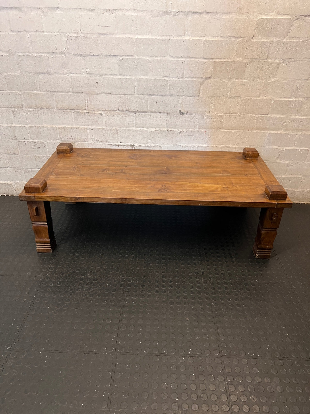 Solid Wooden Coffee Table with Carved Chunky Legs — Visible Wear Throughout – main front view