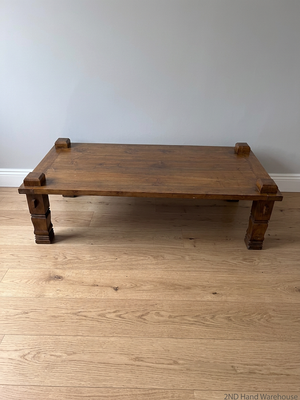 Solid Wooden Coffee Table with Carved Chunky Legs — Visible Wear Throughout – styled product image
