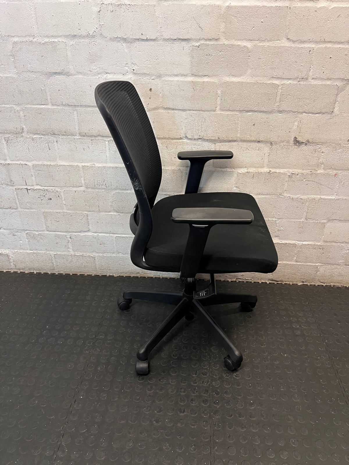 Black Mesh Back Swivel Office Chair with Armrests — Fair Condition with Visible Wear – back view