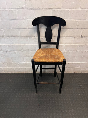 Black T-Back Dining Chair with Woven Seat — Fair Condition with Visible Wear – main front view