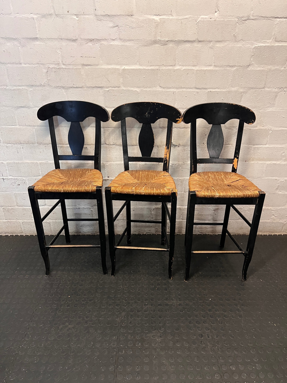 Black T-Back Dining Chair with Woven Seat — Fair Condition with Visible Wear – side view