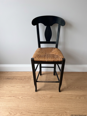 Black T-Back Dining Chair with Woven Seat — Fair Condition with Visible Wear – styled product image
