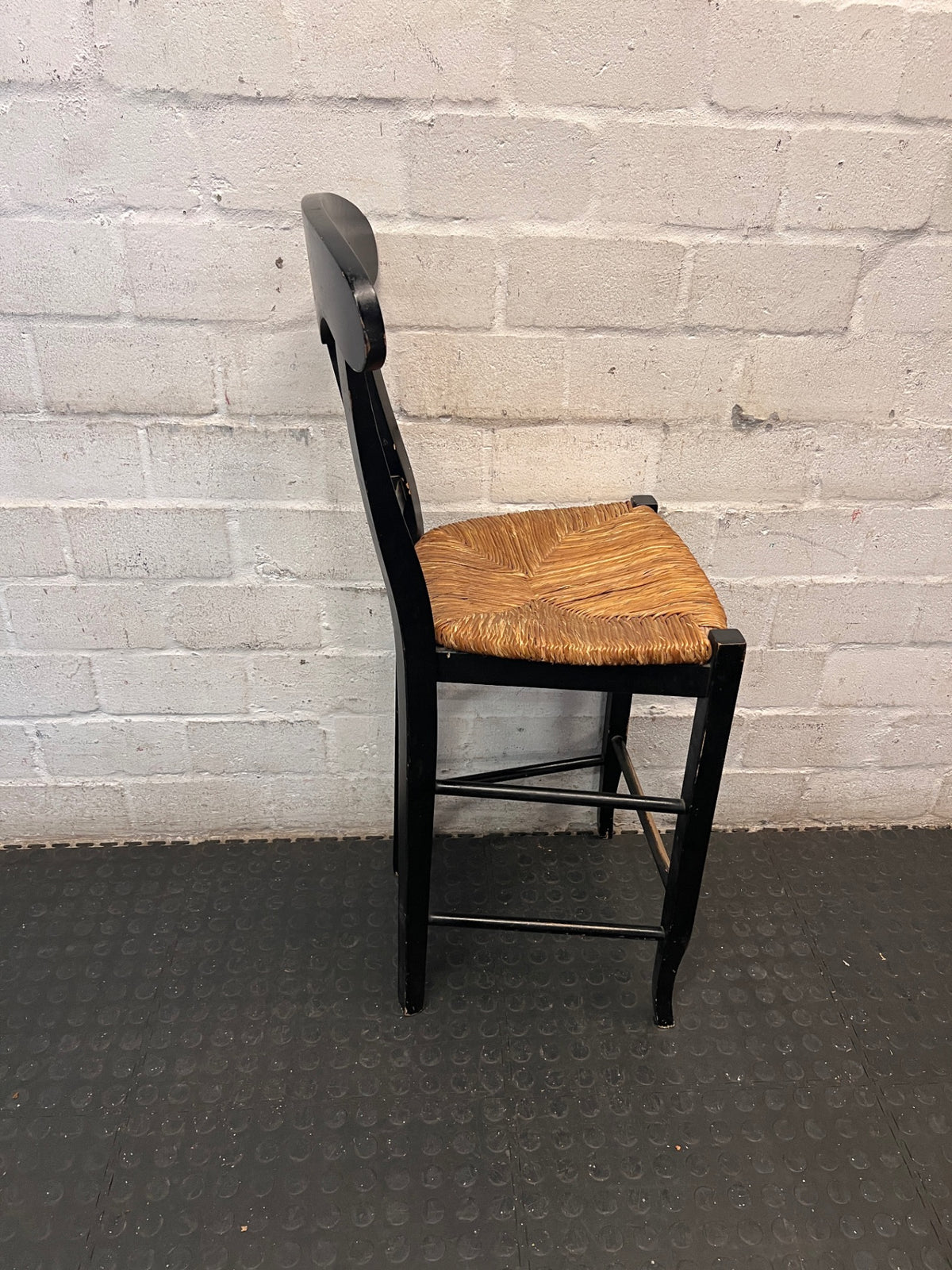 Black T-Back Dining Chair with Woven Seat — Fair Condition with Visible Wear – top view