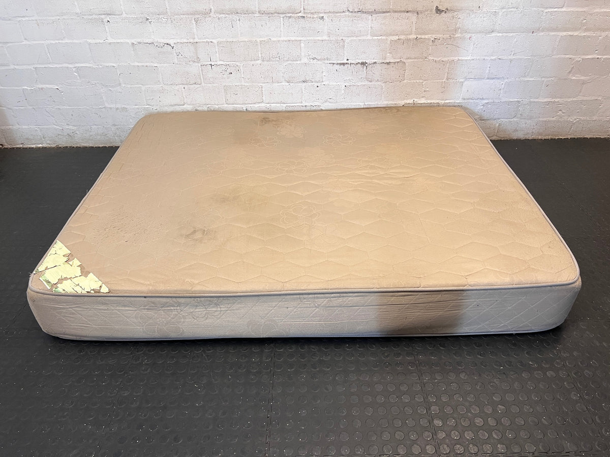 Beige Quilted Double Bed Mattress — Heavy Staining and Torn Corner Fabric – side view