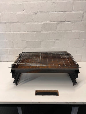 Compact Metal Wood-Burning Braai Stand with Grid — Significant Surface Rust and Heavy Wear – main front view