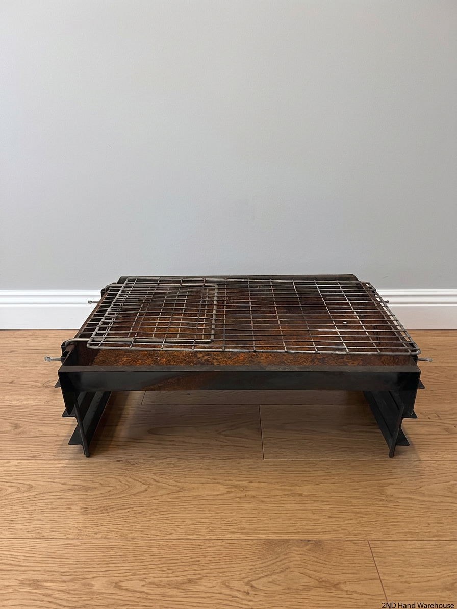 Compact Metal Wood-Burning Braai Stand with Grid — Significant Surface Rust and Heavy Wear – styled product image