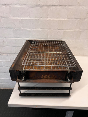 Compact Metal Wood-Burning Braai Stand with Grid — Significant Surface Rust and Heavy Wear – top view