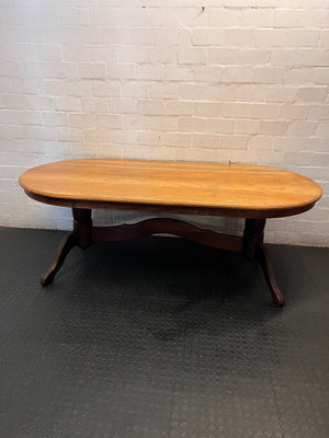 Oval Two-Tone Wooden Dining Table with Trestle Base — Good Working Order with Additional Items Included – back view