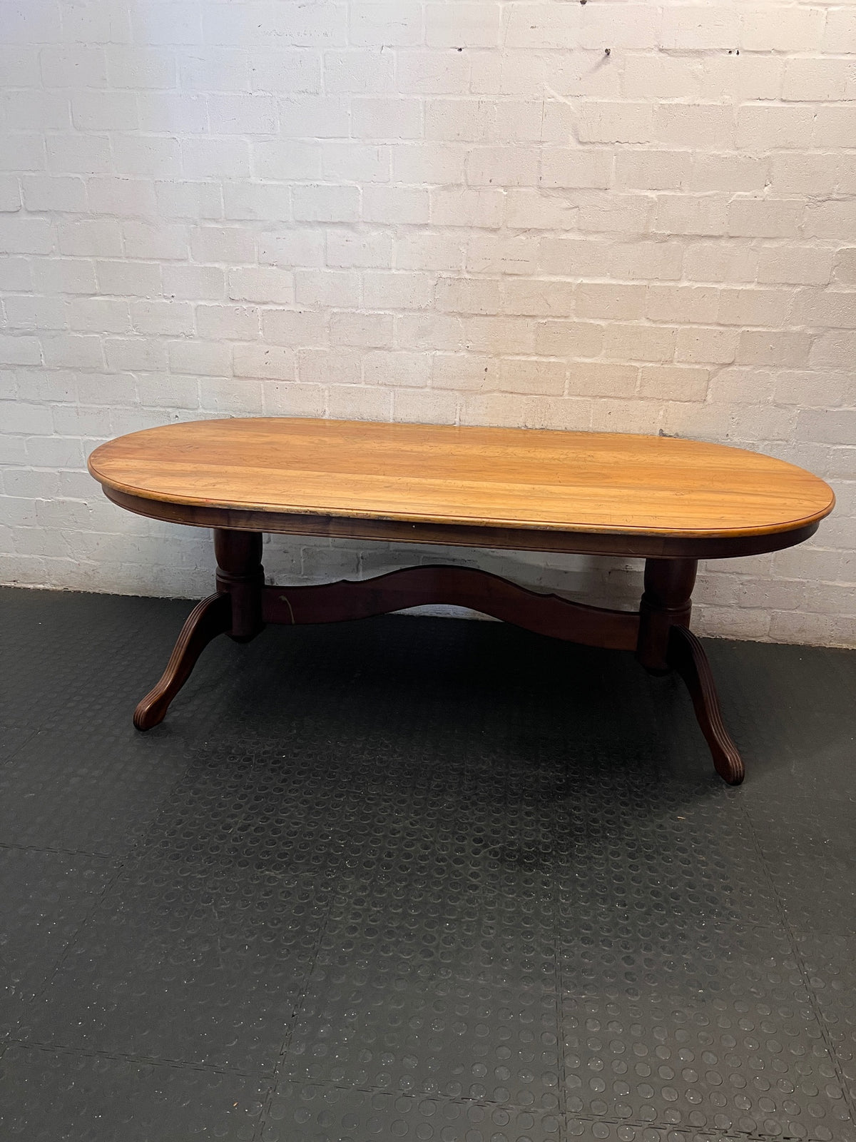 Oval Two-Tone Wooden Dining Table with Trestle Base — Good Working Order with Additional Items Included – main front view
