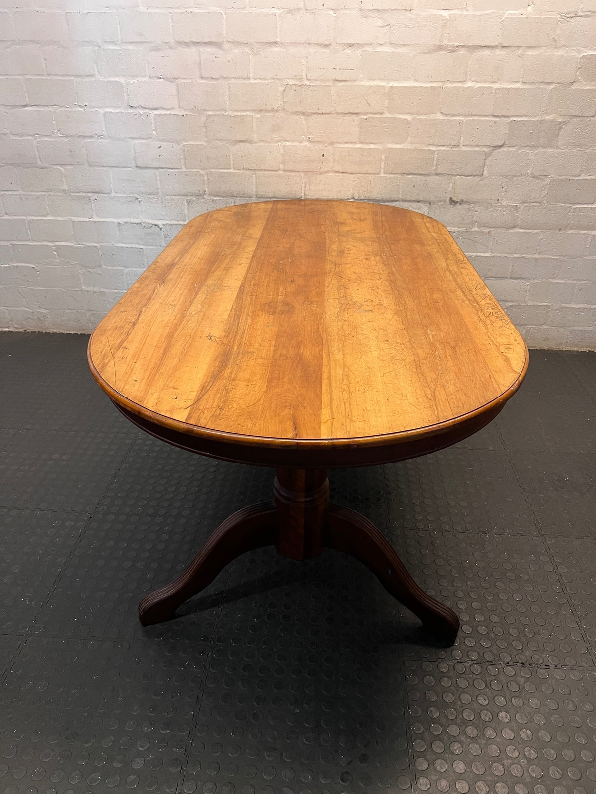 Oval Two-Tone Wooden Dining Table with Trestle Base — Good Working Order with Additional Items Included – side view