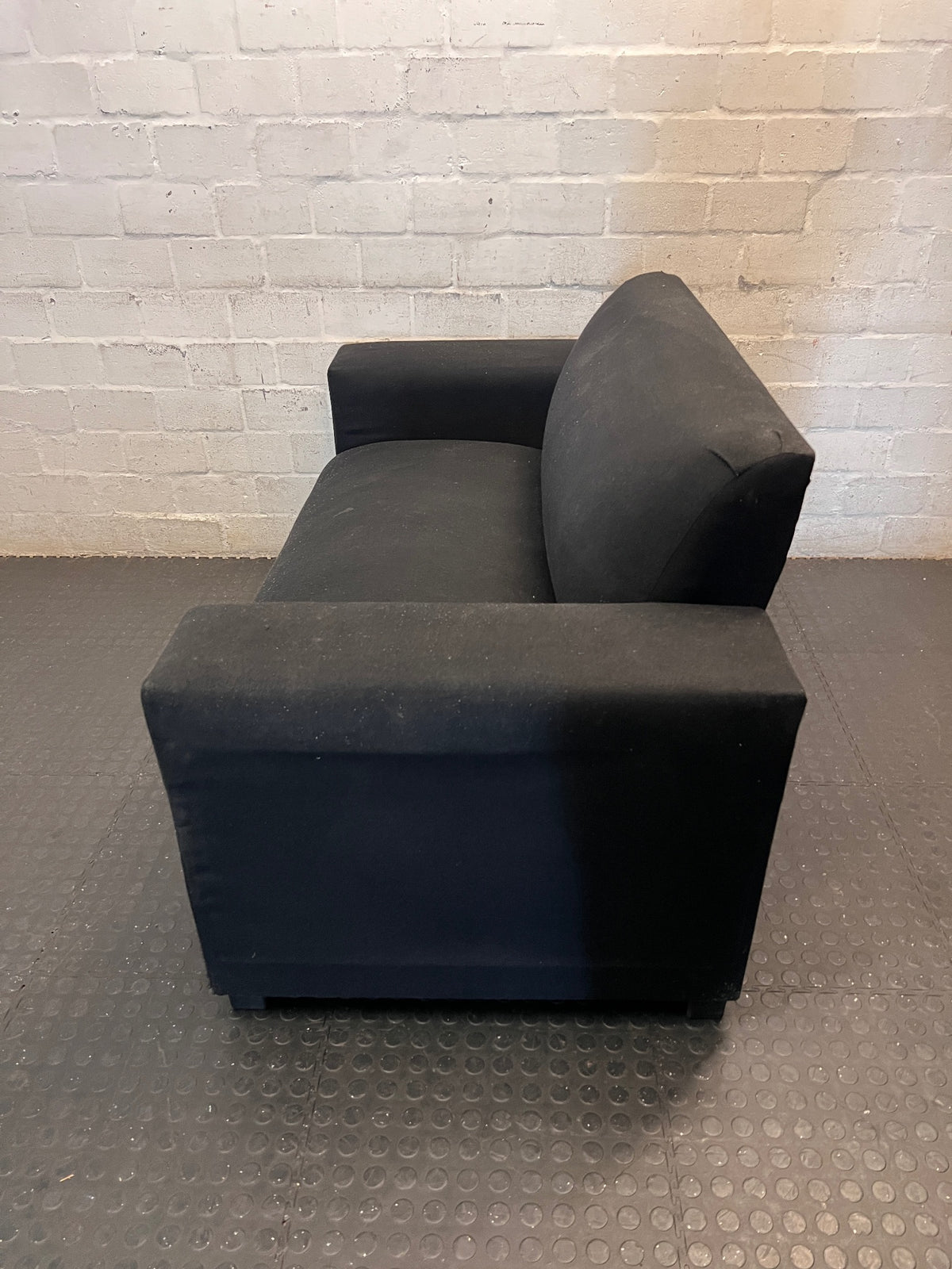 Black Synthetic Polyester 2 Seater Couch — Stains on Material; Good Functionality – side view
