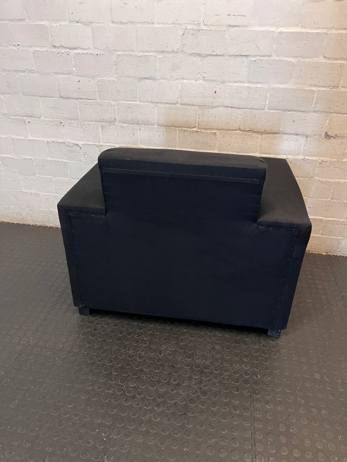 Black Synthetic Polyester 1 Seater Couch — Stains on Material; Intact Structure – condition detail