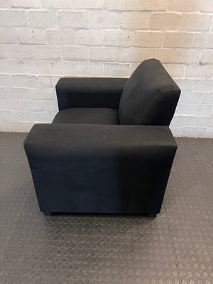 Black Synthetic Polyester 1 Seater Couch — Stains on Material; Intact Structure – side view