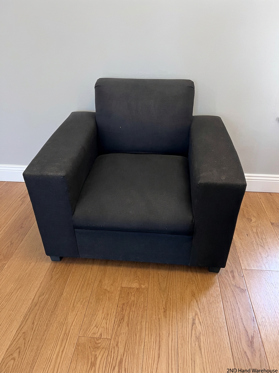 Black Synthetic Polyester 1 Seater Couch — Stains on Material; Intact Structure – styled product image