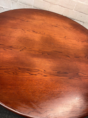 Round Wooden Dining Table with Rattan Style Base — Fair Condition with Visible Wear – back view