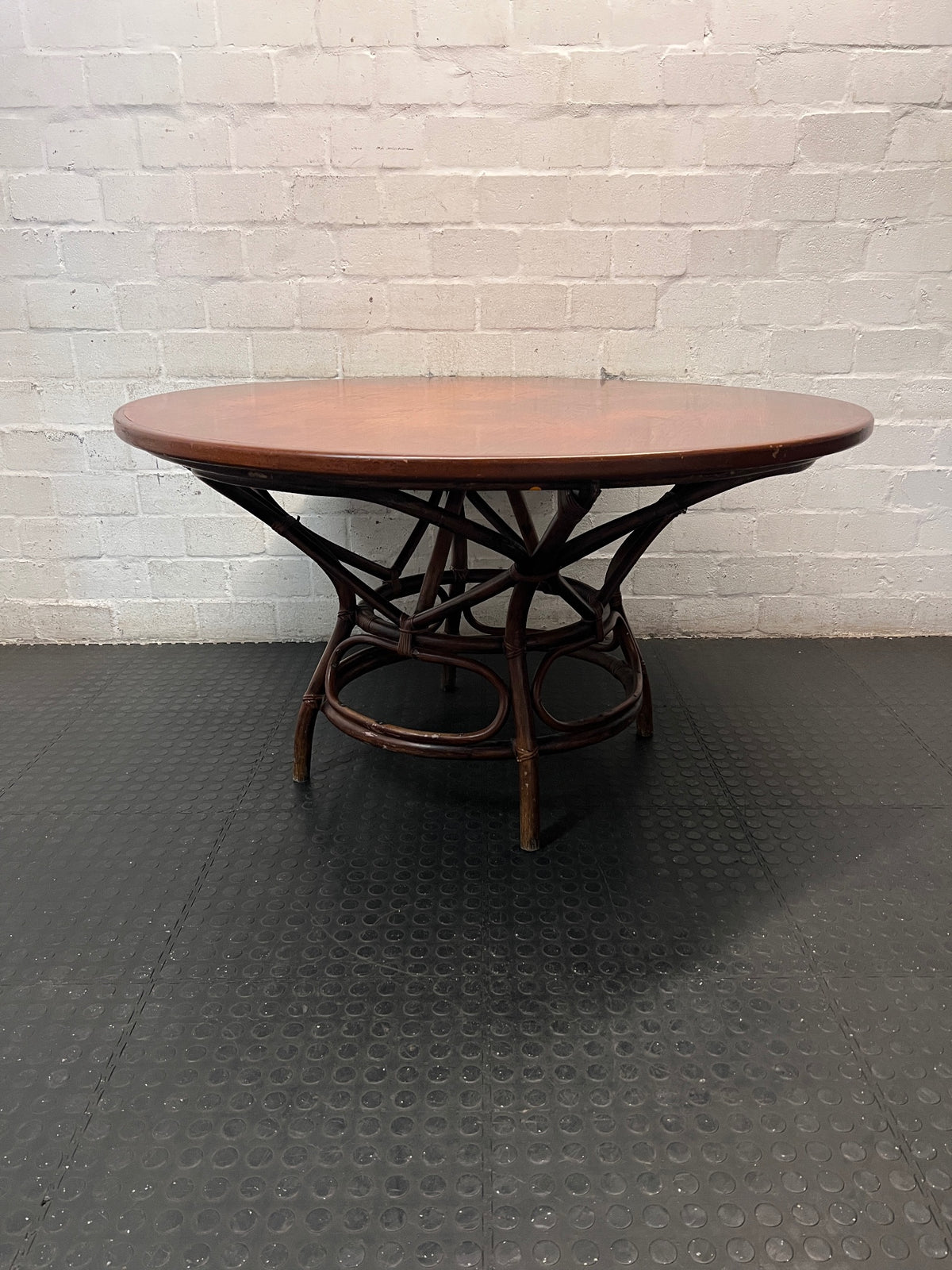 Round Wooden Dining Table with Rattan Style Base — Fair Condition with Visible Wear – top view