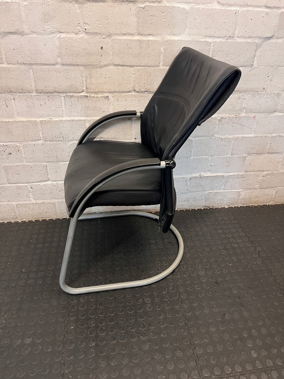 Black Upholstered Visitor Chair with Metal Sleigh Base – back view