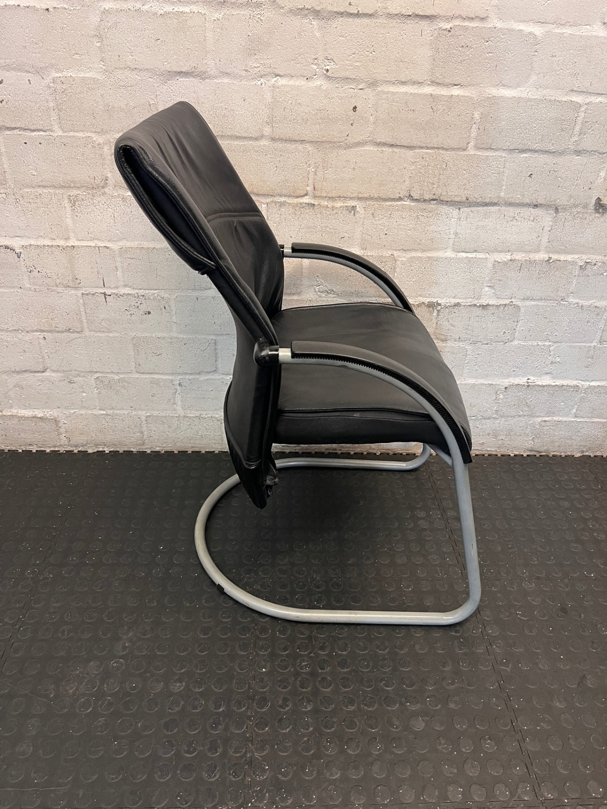 Black Upholstered Visitor Chair with Metal Sleigh Base – side view