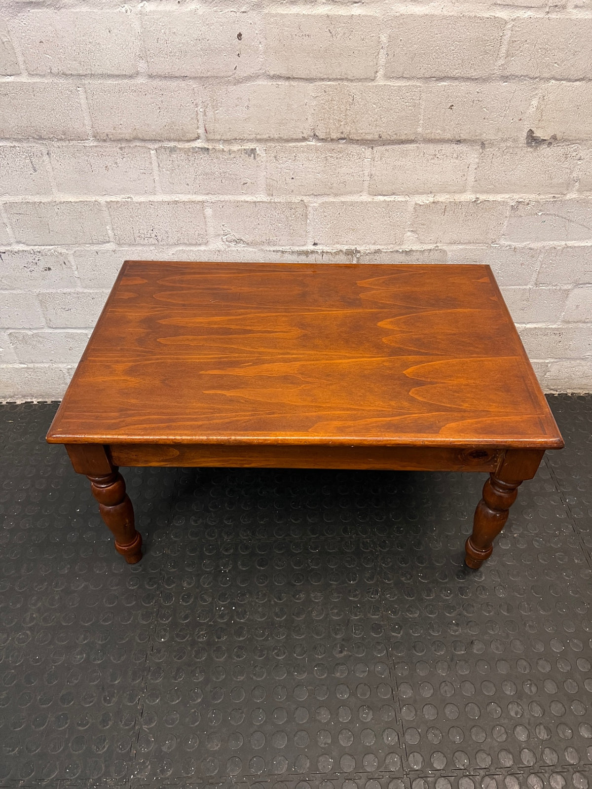 Classic Brown Wooden Coffee Table with Turned Legs — Fair Condition with Visible Wear – main front view