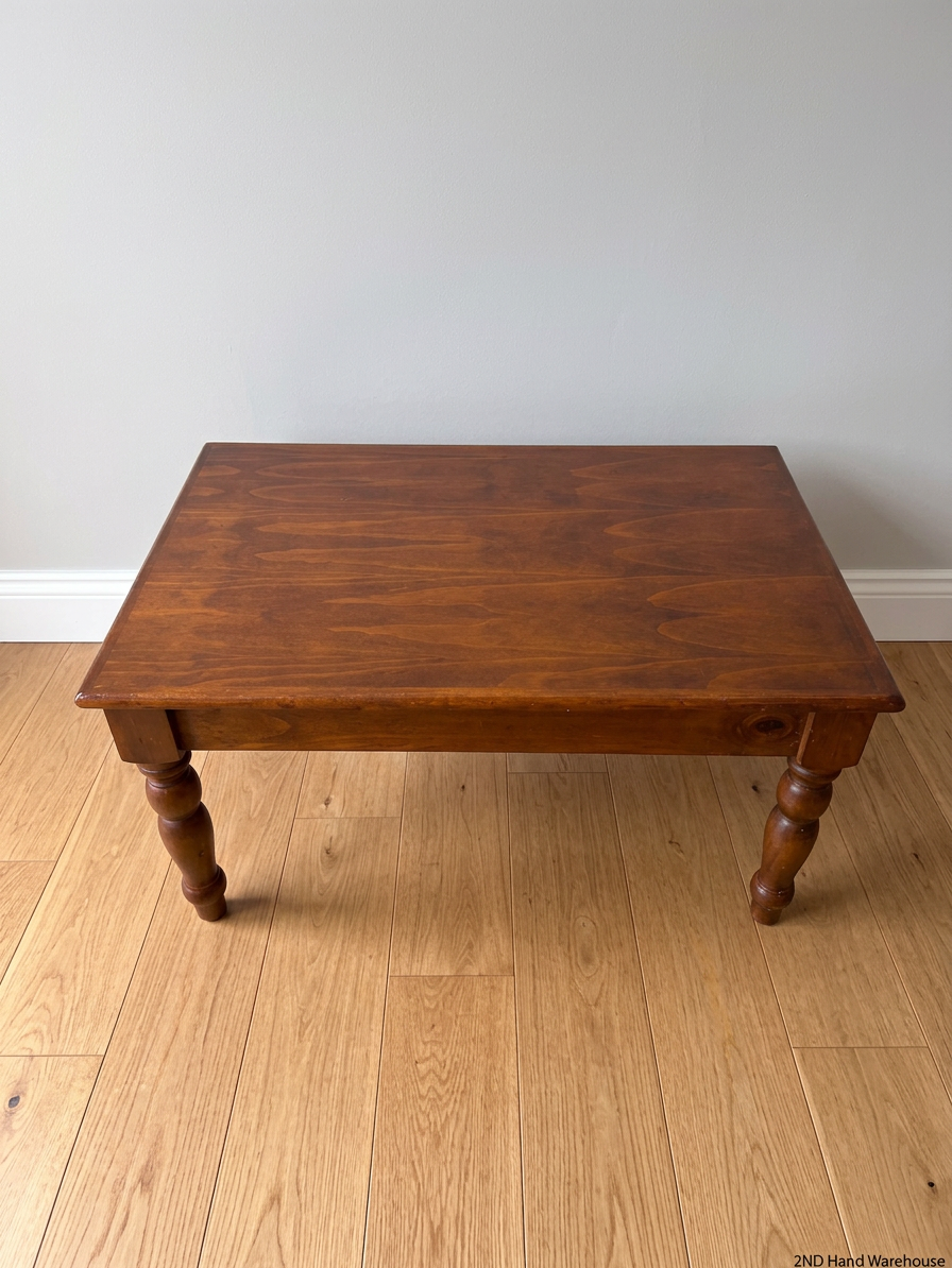 Classic Brown Wooden Coffee Table with Turned Legs — Fair Condition with Visible Wear – styled product image