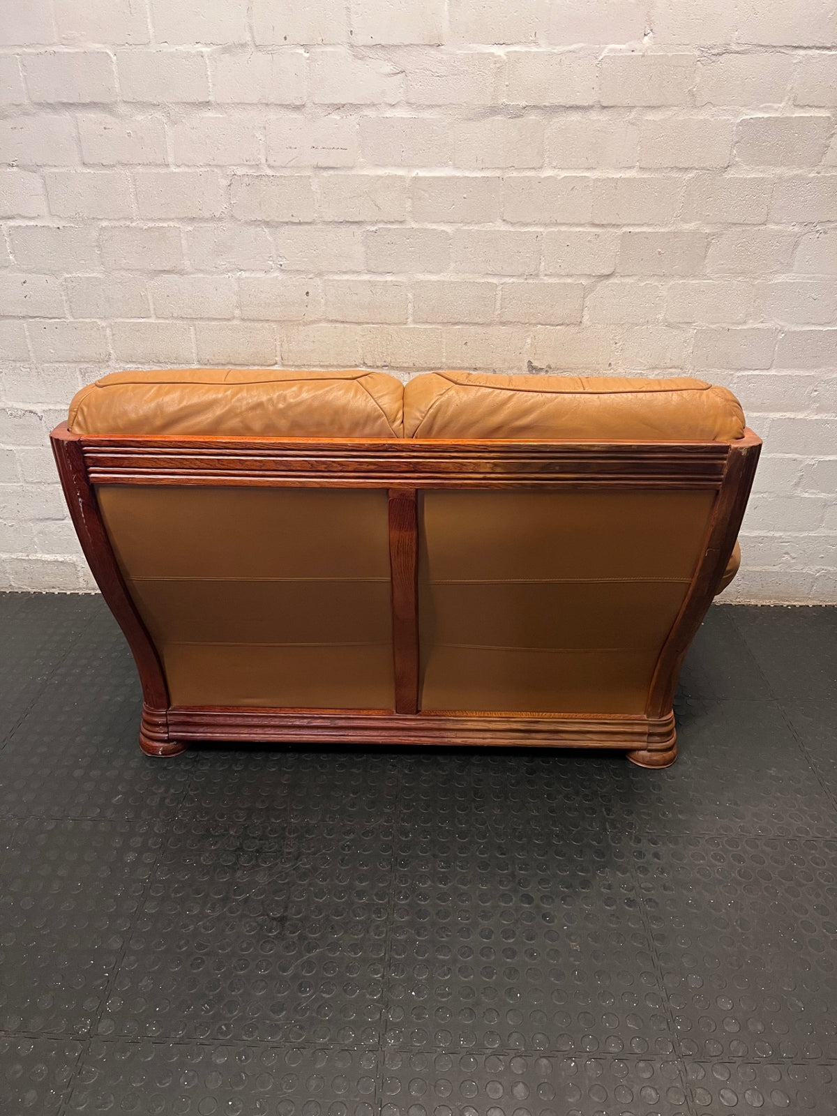 Tan Brown 2 Seater Couch with Carved Wooden Base — Good Condition – back view